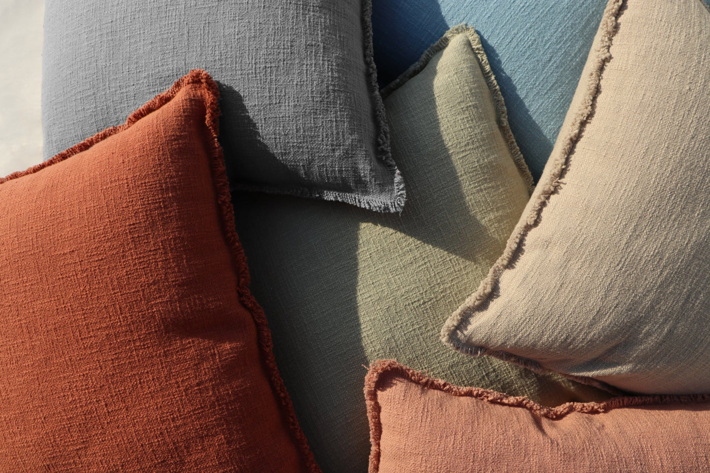 Organic Chic washed textured cotton solid lumbar pillow cover with frayed edges