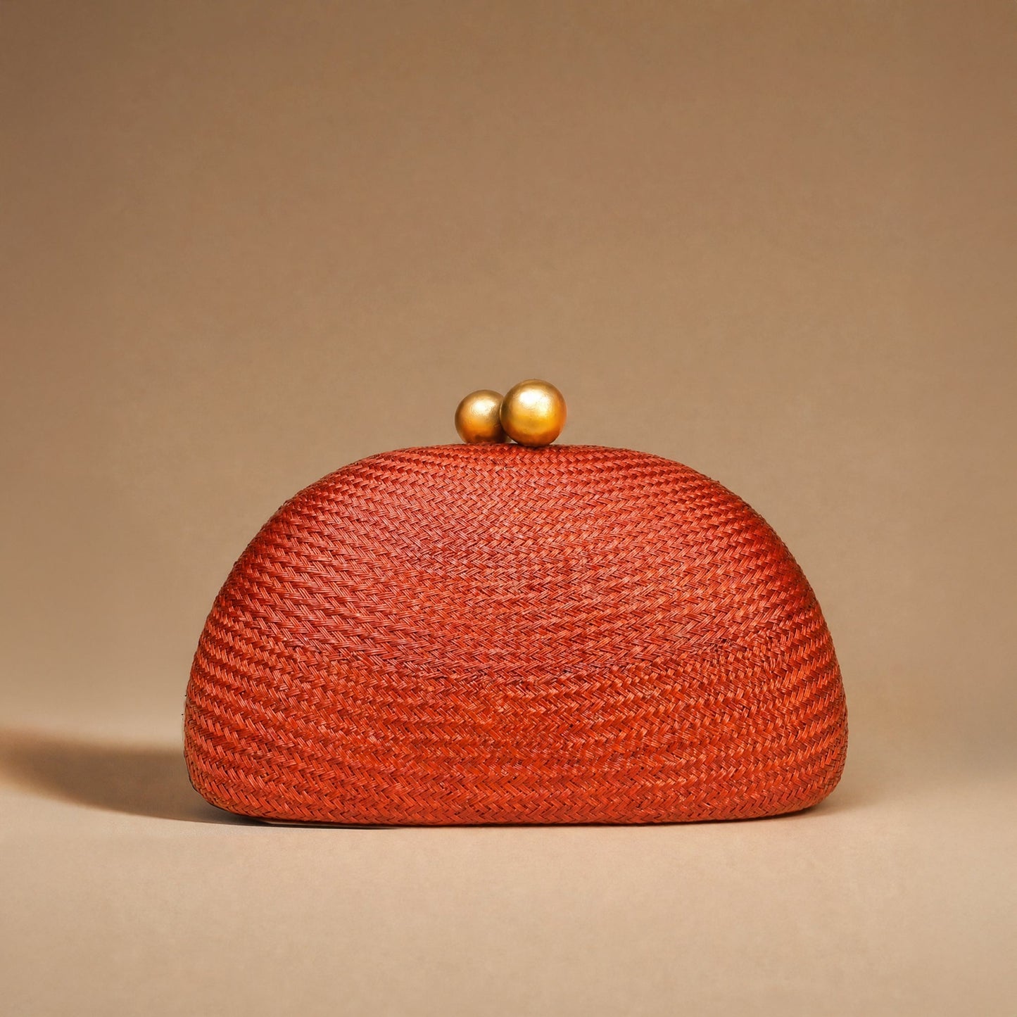 THE HELENA — Rust Woven Straw Clutch with Gold Ball Clasp