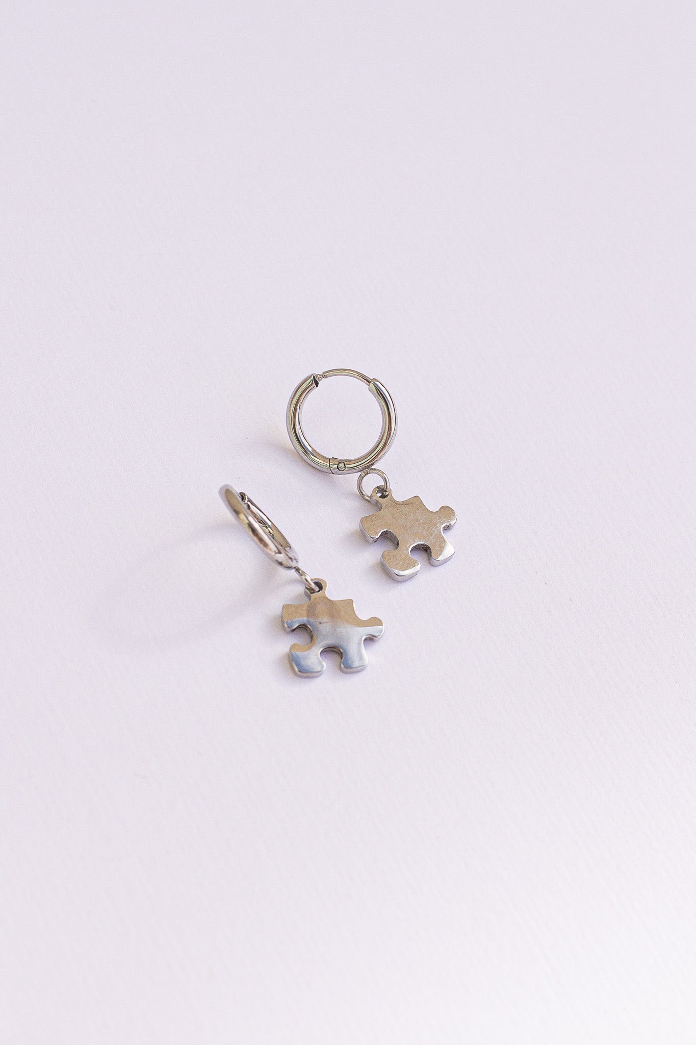 Puzzle Piece Huggie Hoops